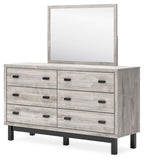 Gray dresser with mirror, six drawers with black bar pulls, sturdy wooden legs
