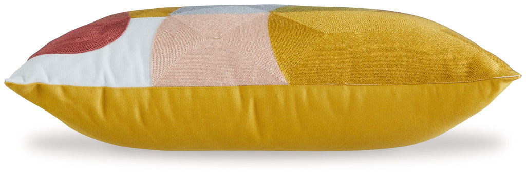 Yellow back pillow with rust and white geometric corner