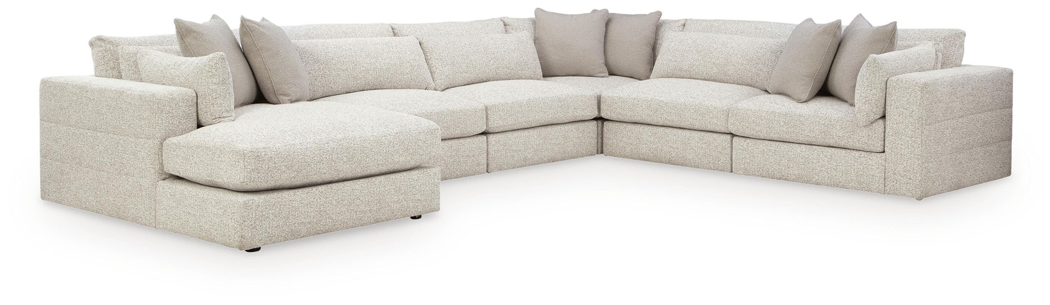 Beige sectional sofa with double chaise and corner chaise, tufted seat cushions and pillows