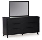 Black dresser with multiple drawer fronts and standing mirror, square outer frame