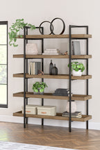 Wood bookcase with black frame and multiple open shelves, styled with decor items