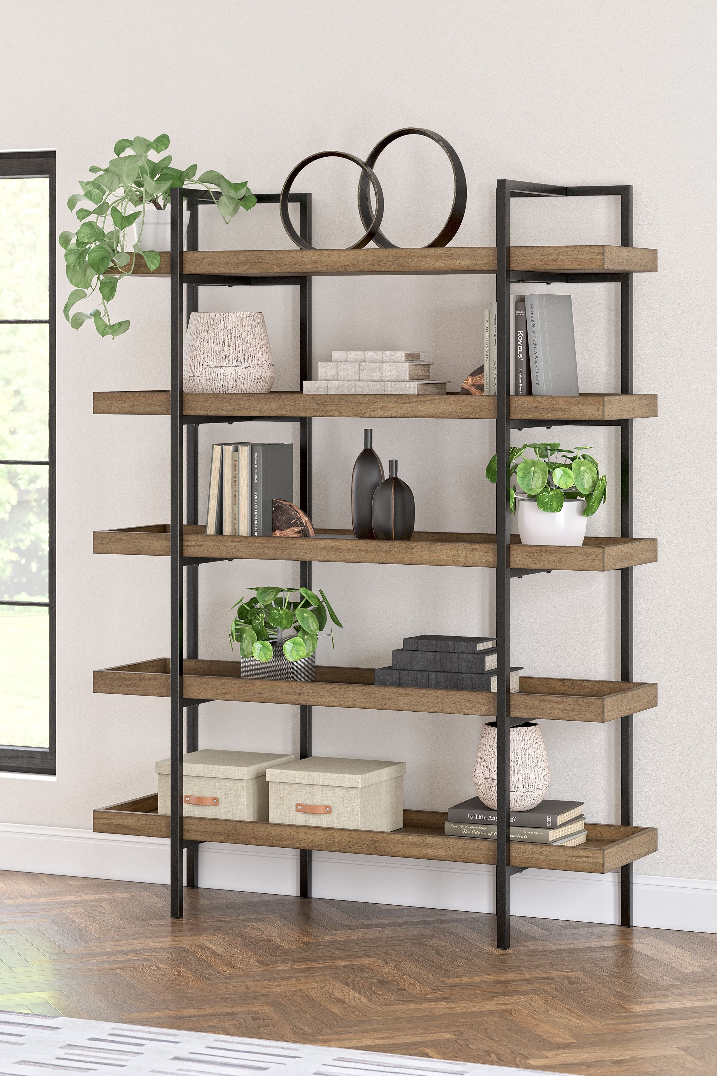 Wood bookcase with black frame and multiple open shelves, styled with decor items