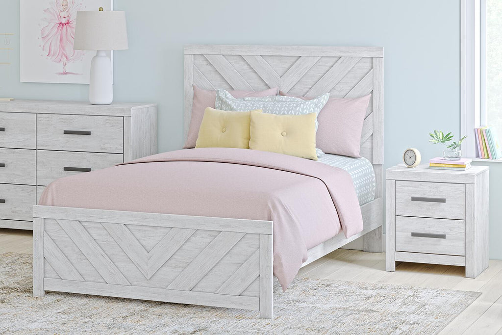 Light gray panel bed with chevron-pattern headboard and footboard, pink and white bedding