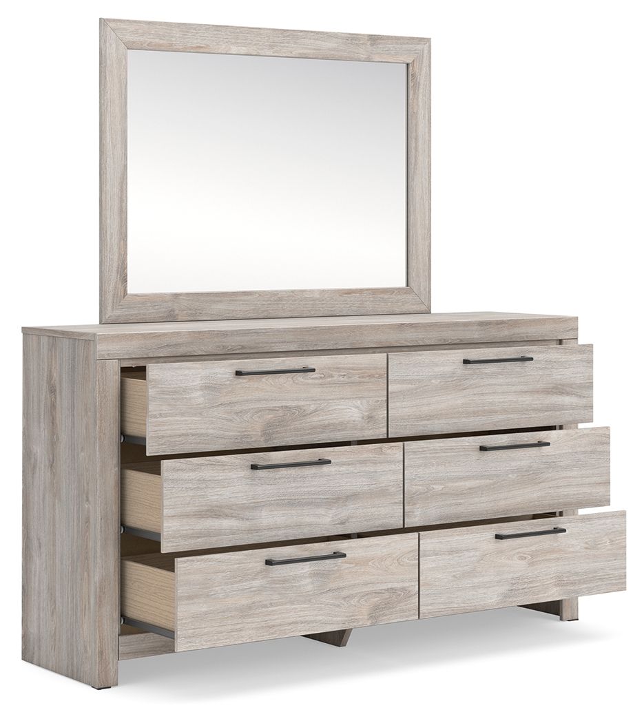 Six-drawer dresser with framed mirror and light wood drawer fronts with metal bar pulls.