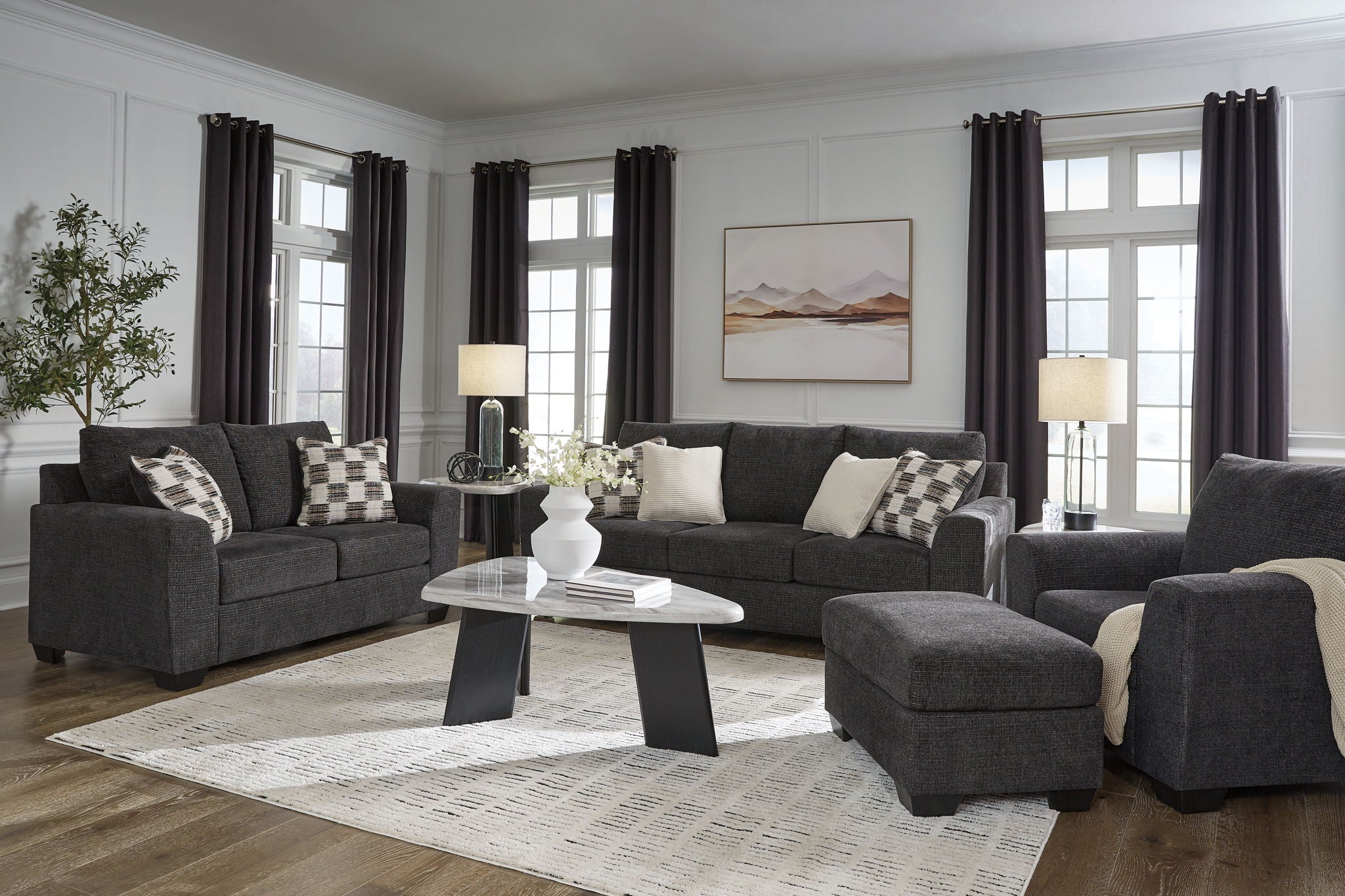 Loreo living room set dark gray sofa, chairs, and matching ottoman with throw pillows