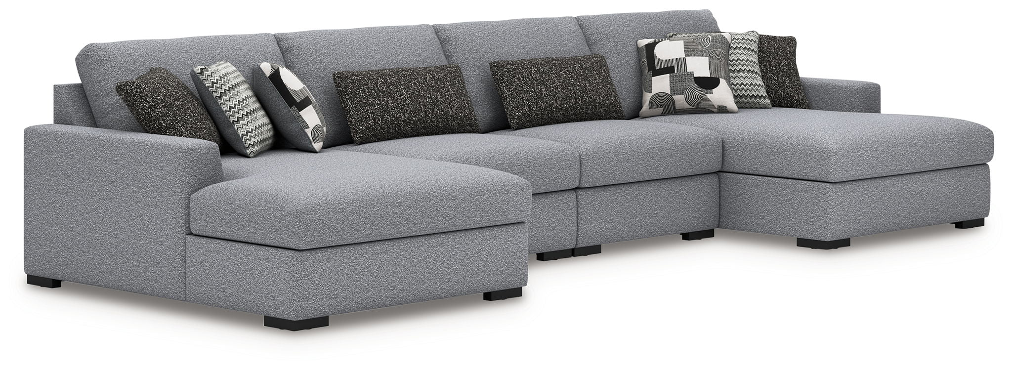 Gray fabric sectional sofa with corner chaise and patterned throw pillows
