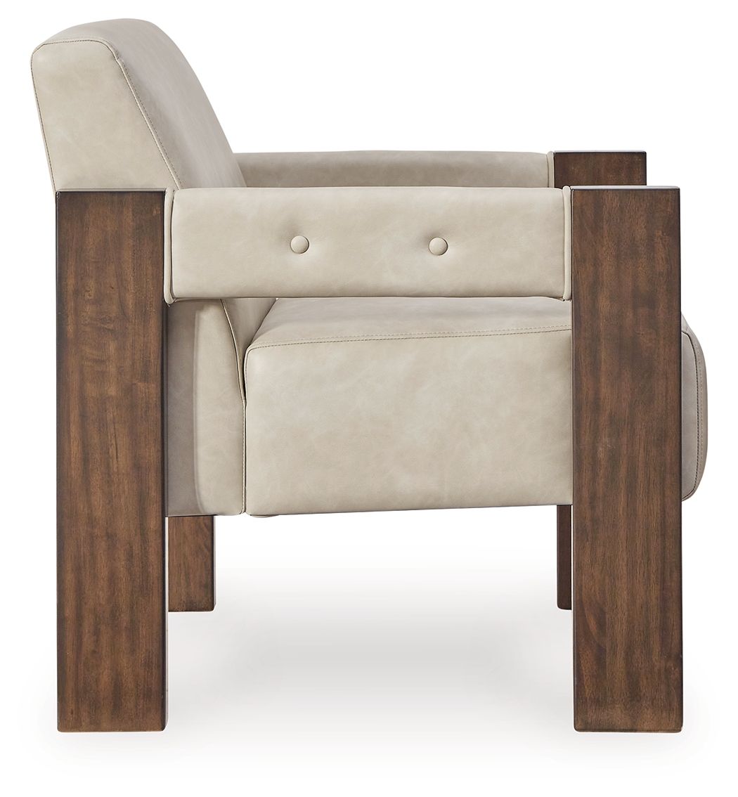 Beige accent chair with dark wood frame, button-tufted back, and side arm rests