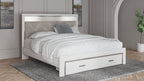 White upholstered storage bed with gray tufted headboard and two front drawers