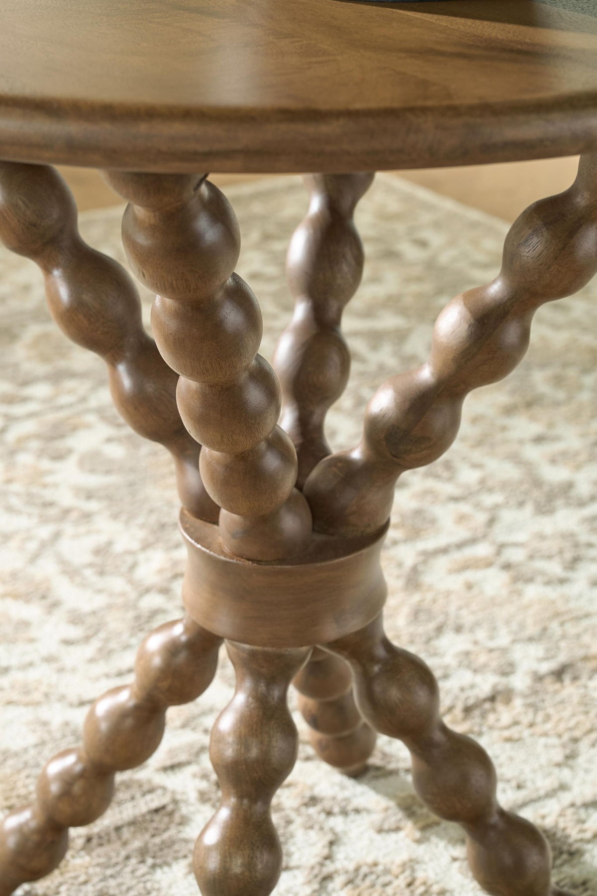 Light brown carved pedestal base with twisted, turned support legs