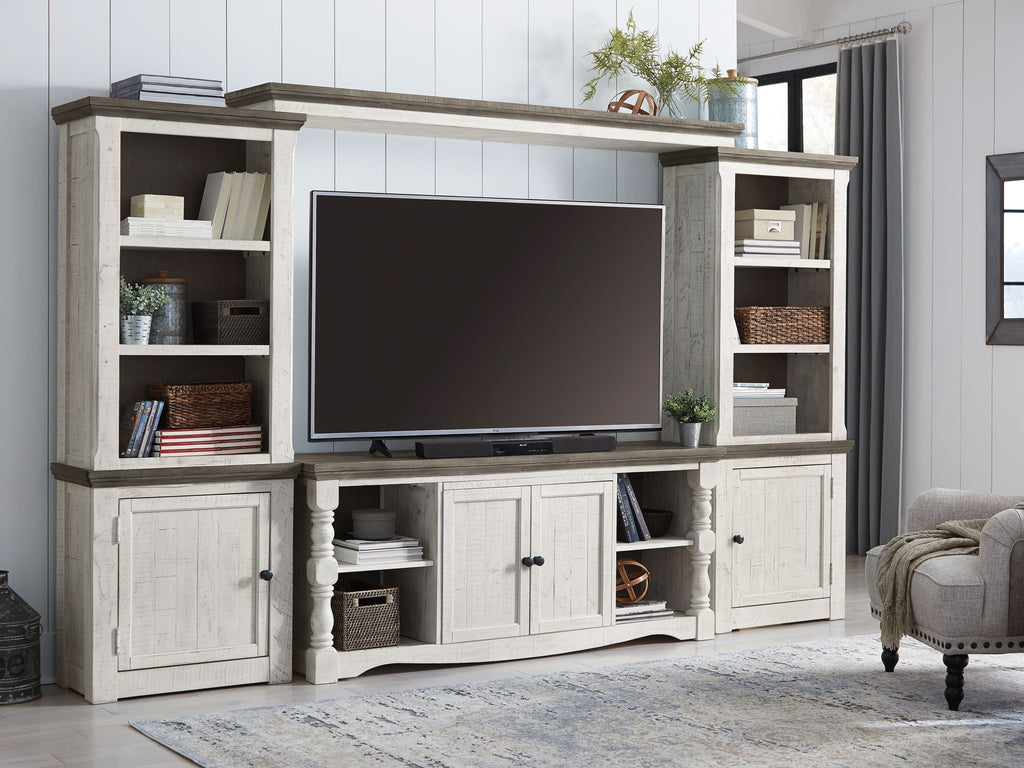 Entertainment center TV stand with open center shelving and side storage cabinets, whitewashed