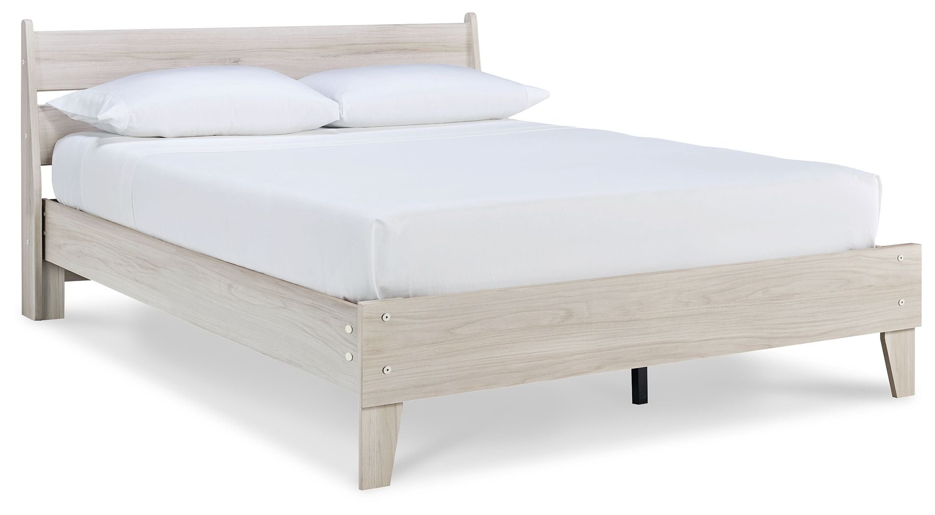 Light wood panel platform bed with white sheet and raised side rails