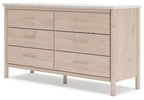 Light wood six-drawer dresser with six panel fronts and metal bar pulls, side view