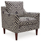 Chevron-pattern accent chair with cushioned seat and arms, dark charcoal and light natural