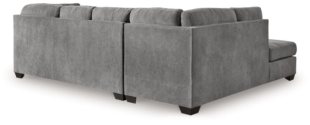 Gray sectional sleeper sofa with tufted backrest, corner chaise, and padded arm panels