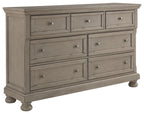 Lettner light gray dresser with multiple drawers and round metal knobs