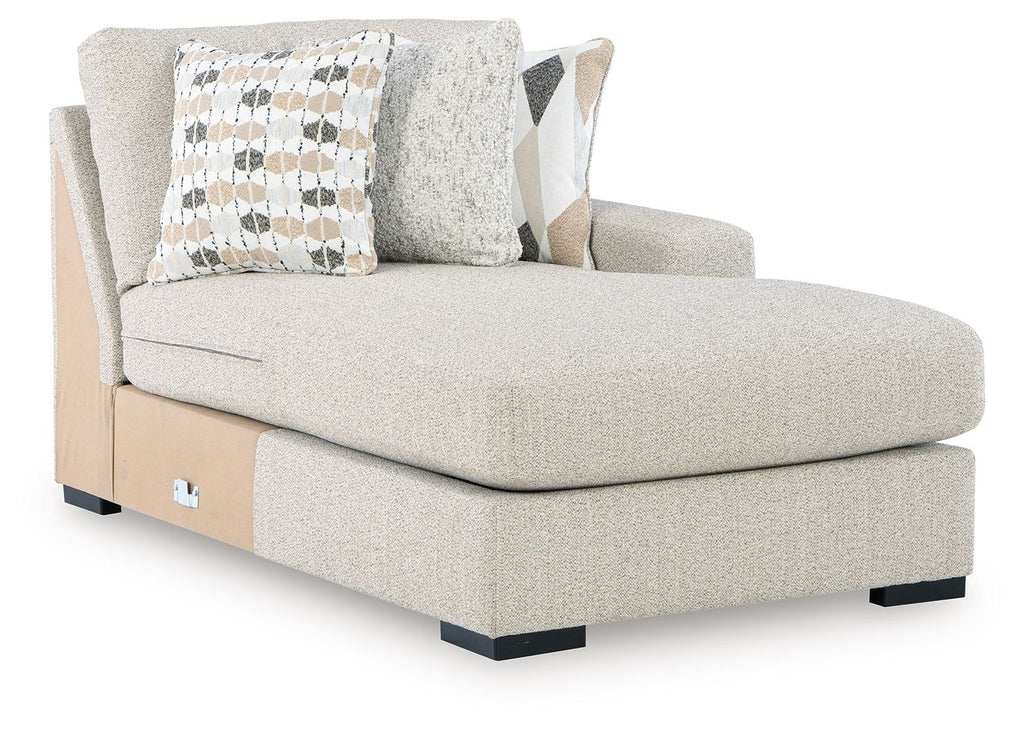 Upholstered pebble corner chaise with throw pillows and open side