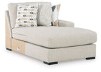Upholstered pebble corner chaise with throw pillows and open side