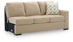 Almond fabric RAF sofa with three seat cushions, geometric throw pillow, and black base feet