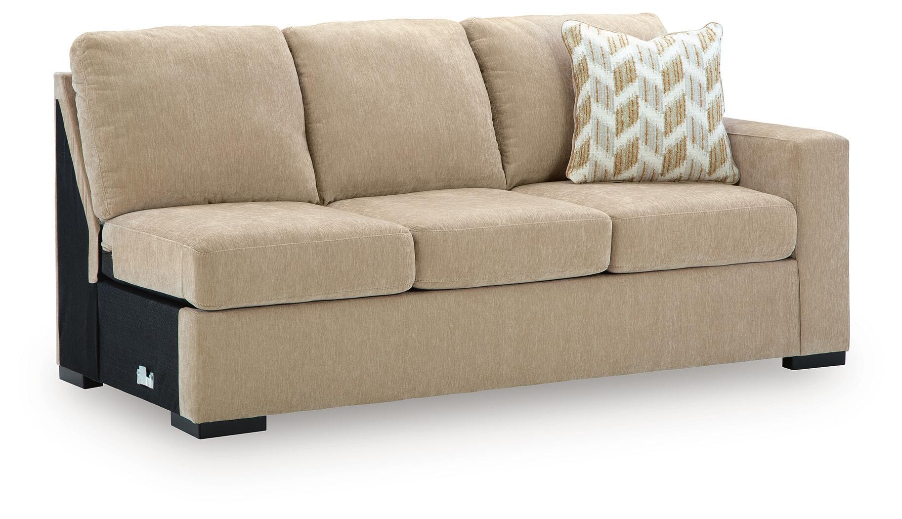 Almond fabric RAF sofa with three seat cushions, geometric throw pillow, and black base feet