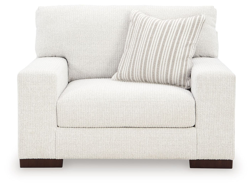 Frosted chair and a half with light upholstery, striped back cushion, dark legs