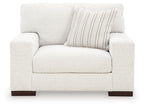 Frosted chair and a half with light upholstery, striped back cushion, dark legs
