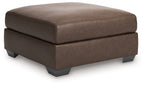Oversized accent ottoman in dark brown upholstered fabric with square tufted top
