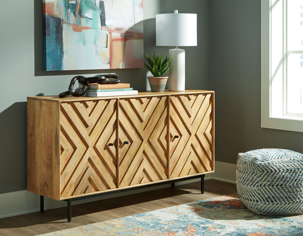Natural wood accent cabinet with geometric chevron doors and black tapered legs