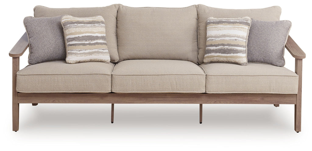 Sofa with cushions in natural beige with three striped throw pillows and two gray arms