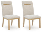 Light beige upholstered dining side chair with wooden legs and gold bar handle