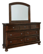Dark brown dresser with arched mirror and three-drawer top, six small drawers below