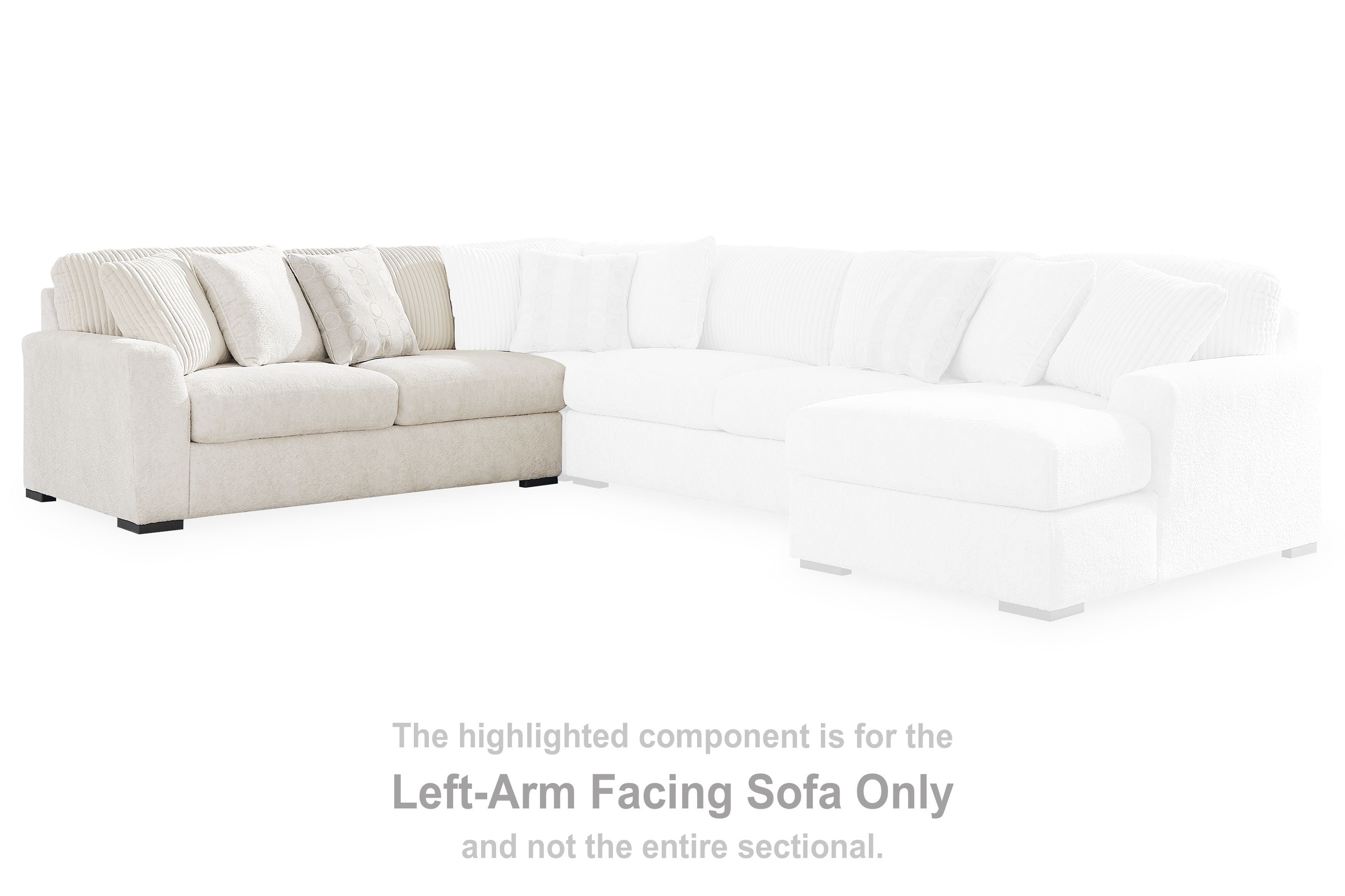 Light ivory sectional sofa with left-facing chaise and multiple throw pillows