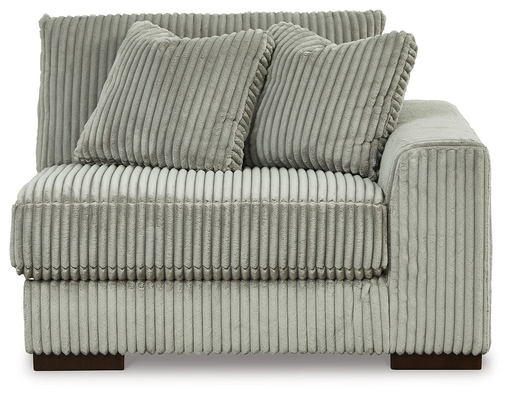 Fog corduroy corner chair with ribbed upholstery, two back pillows, and boxy armrest