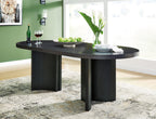 Black oval dining room table with dark wood grain and four pedestal legs