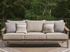 Outdoor sofa with cushions in natural beige, two gray arm cushions, four striped pillows