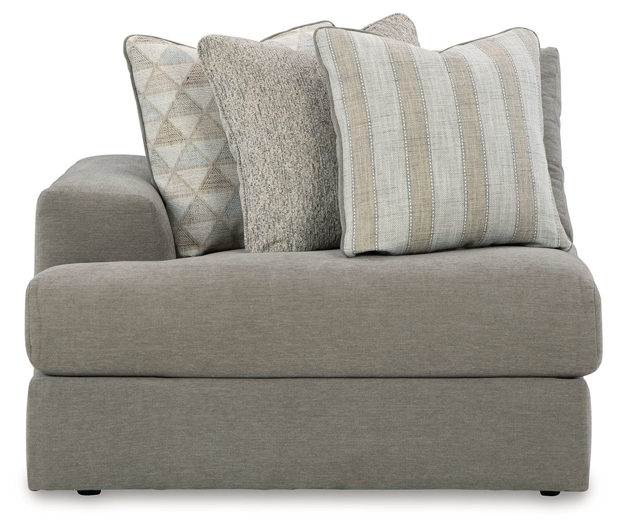 Gray upholstered corner chair with three patterned throw pillows and broad seat cushion