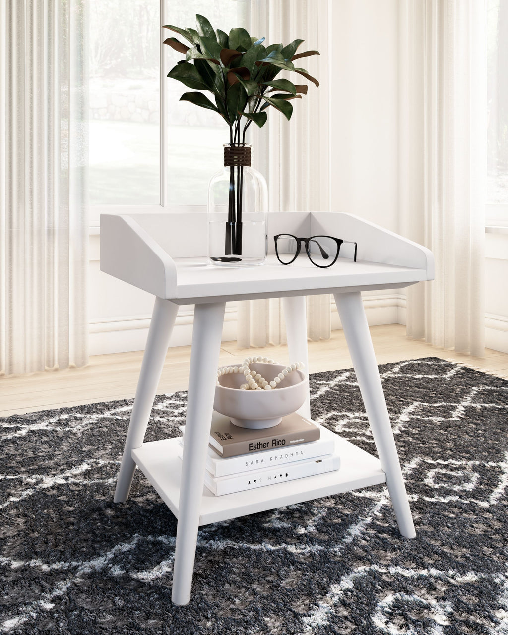 White accent table with lower shelf and decor on top
