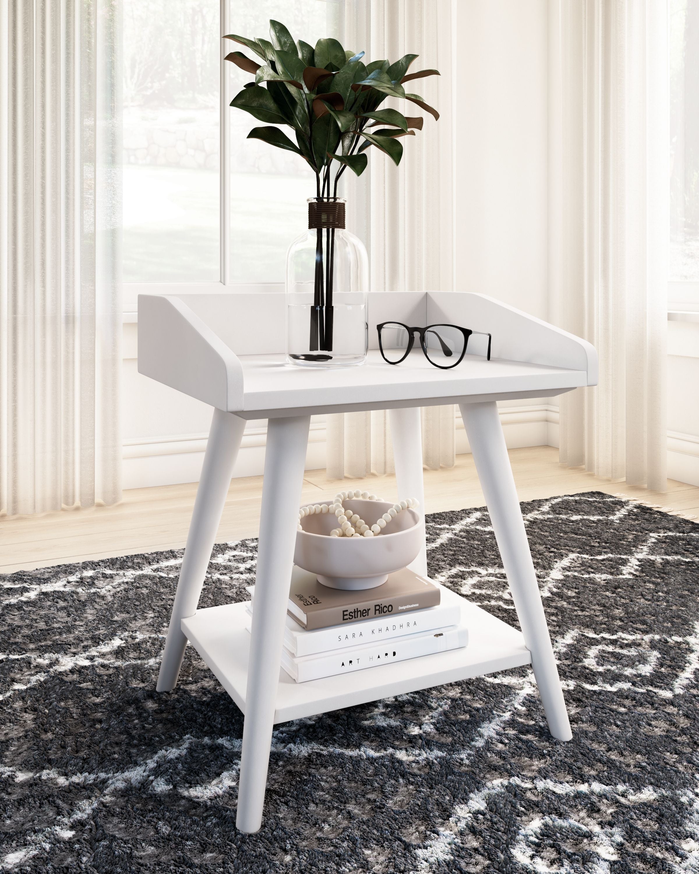White accent table with lower shelf and decor on top