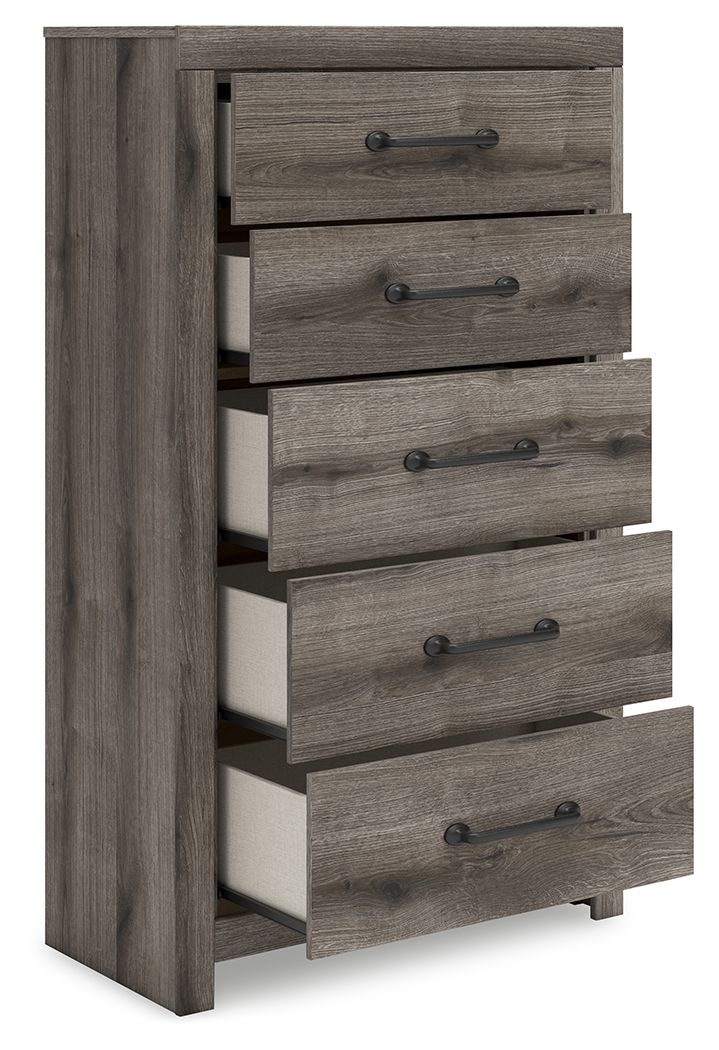 Five-drawer chest with open drawers on gray wood frame, side view.
