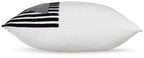 White pillow with black-and-white striped fabric patch on the corner