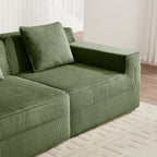 Green corduroy sectional sofa with square arms and striped upholstery, corner seat