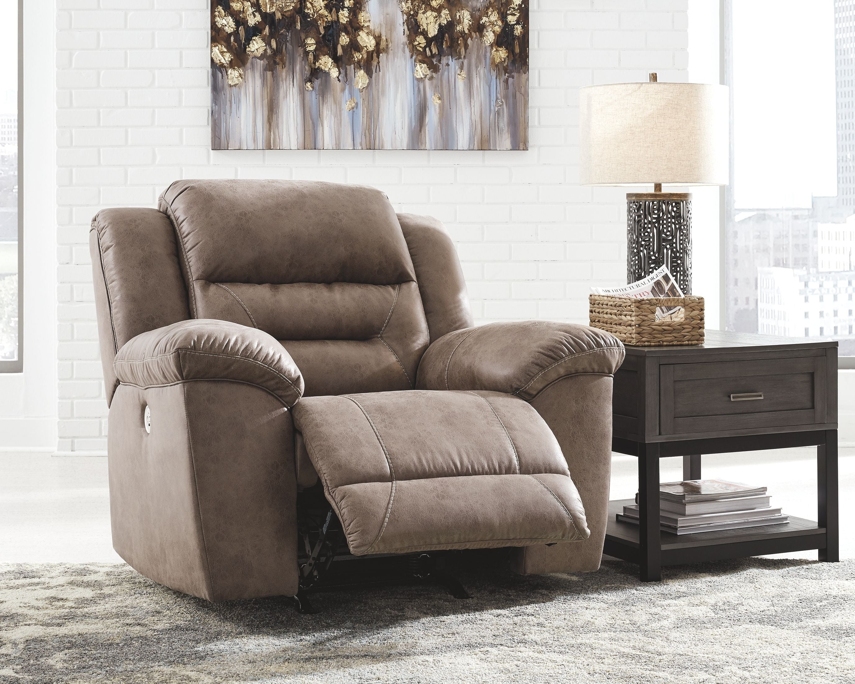 Light brown power reclining armchair with padded arms and seat cushions