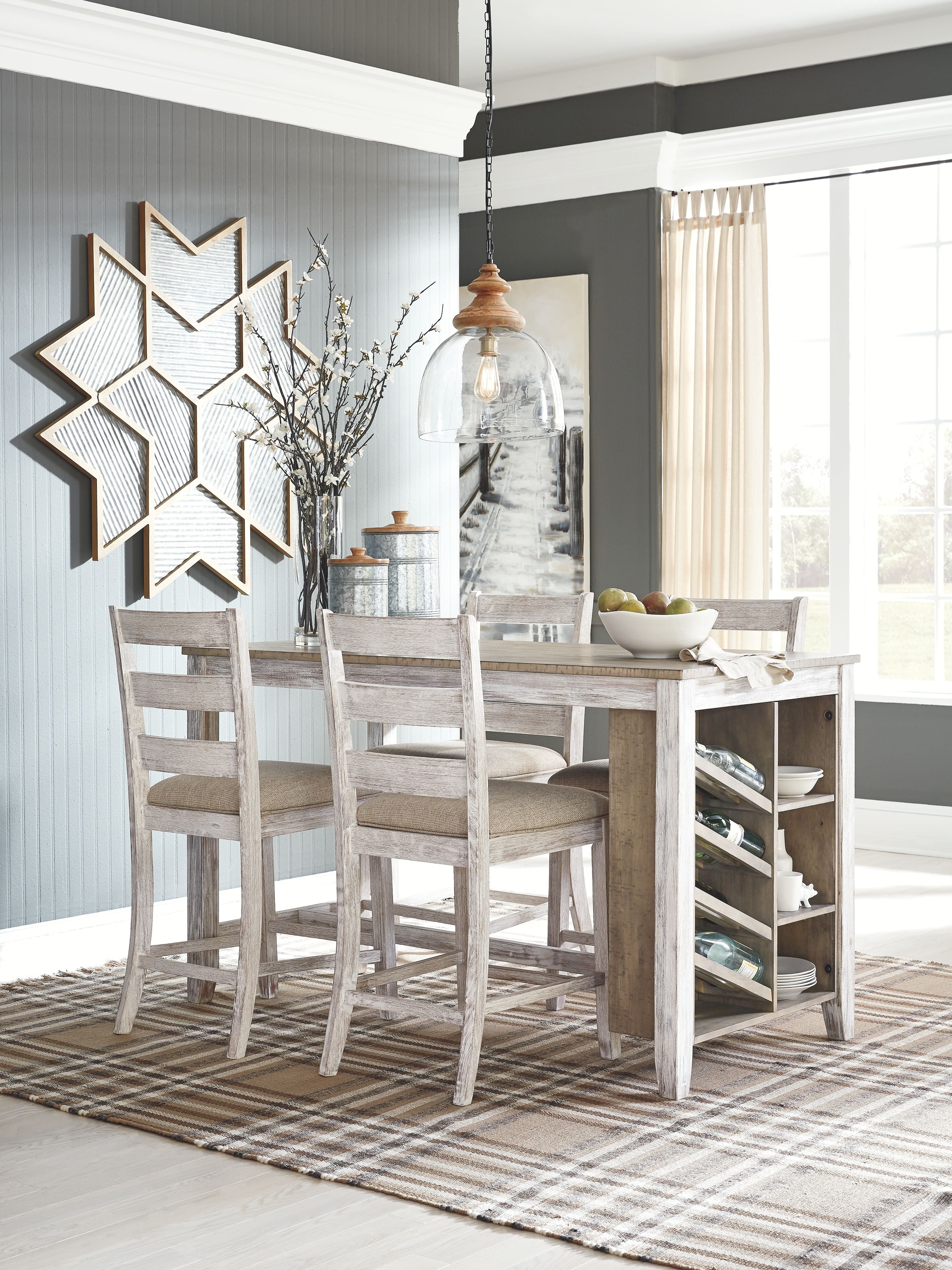 Rectangular counter table with storage shelves and two weathered gray barstools