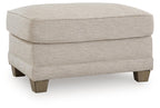 Tufted opal fabric ottoman with hinged lid and dark wood legs