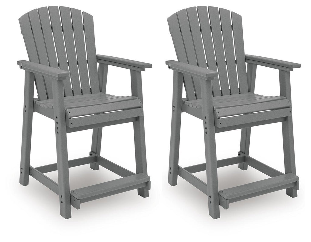 Two dark gray wooden barstools with slatted backs, armrests, and footrests.