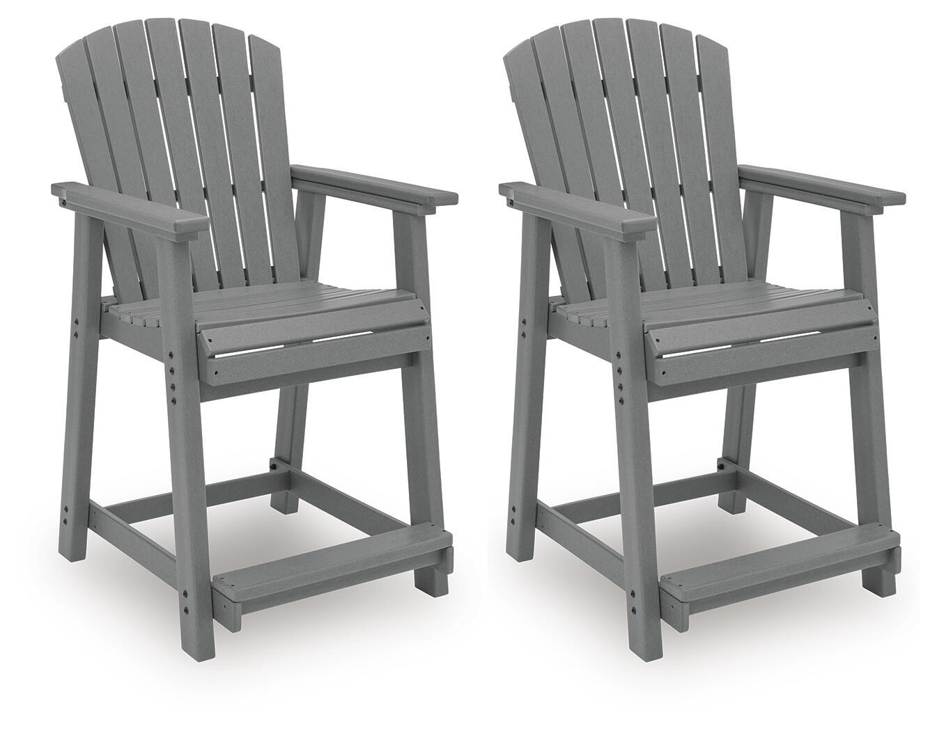 Two dark gray wooden barstools with slatted backs, armrests, and footrests.