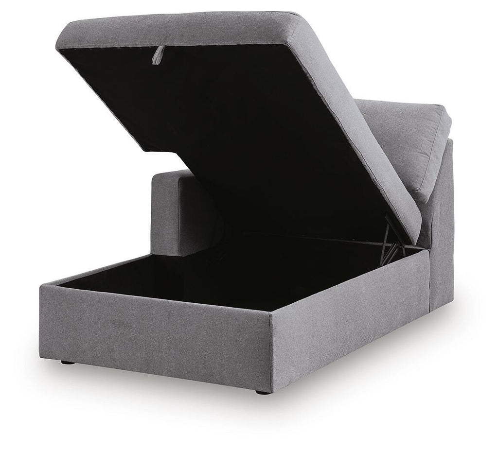 Gray chaise with lift-top storage compartment and hinged lid panel