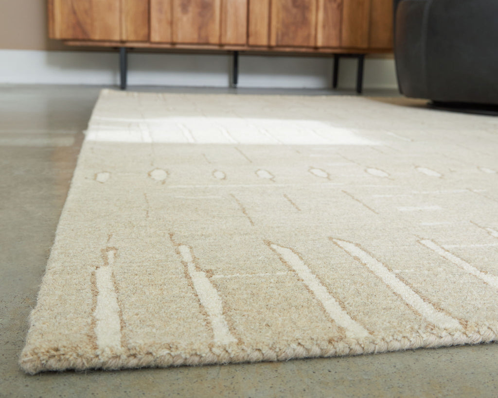 Light brown rug with abstract linear pattern