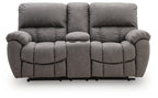 Dark gray power recline loveseat with quilted seat cushions and padded headrests