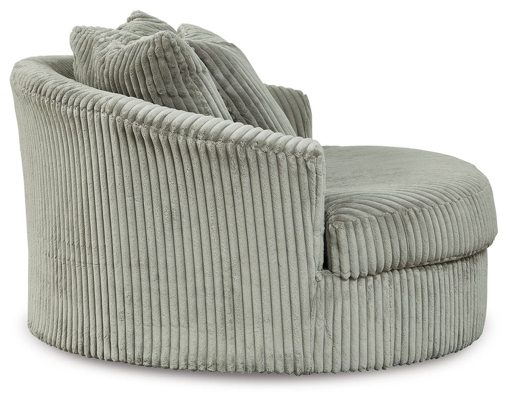 Gray oversized swivel accent chair angled view with ribbed upholstery and thick arms