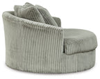 Gray oversized swivel accent chair angled view with ribbed upholstery and thick arms